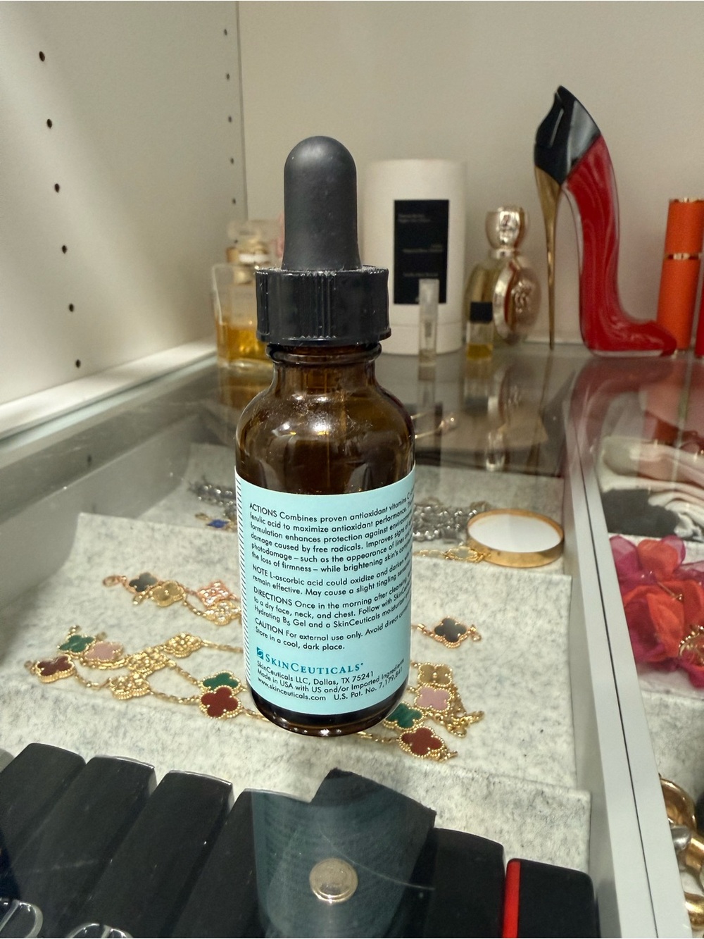 SkinCeuticals Brown Glass Serum Bottle with Light Blue Label and Black Dropper